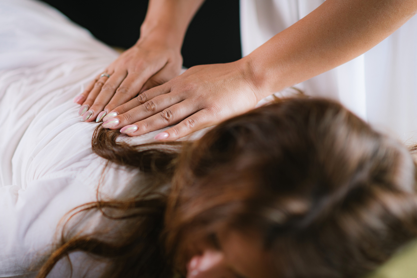Massage Therapist Massaging Woman